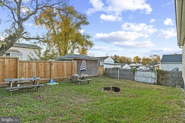 a view of a backyard with sitting area
