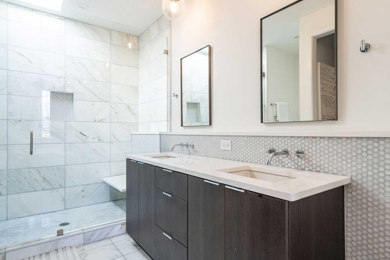 424 Chavis Way Raleigh, NC 27601 - Photo 12 of 23 a bathroom with double sink and a mirror