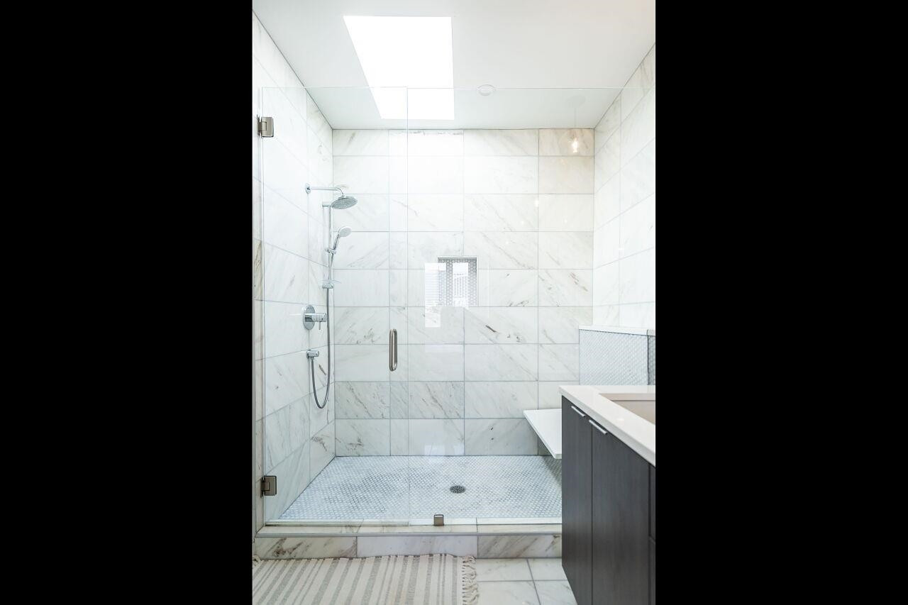 424 Chavis Way Raleigh, NC 27601 - Photo 13 of 23 a bathroom with a bathtub and shower