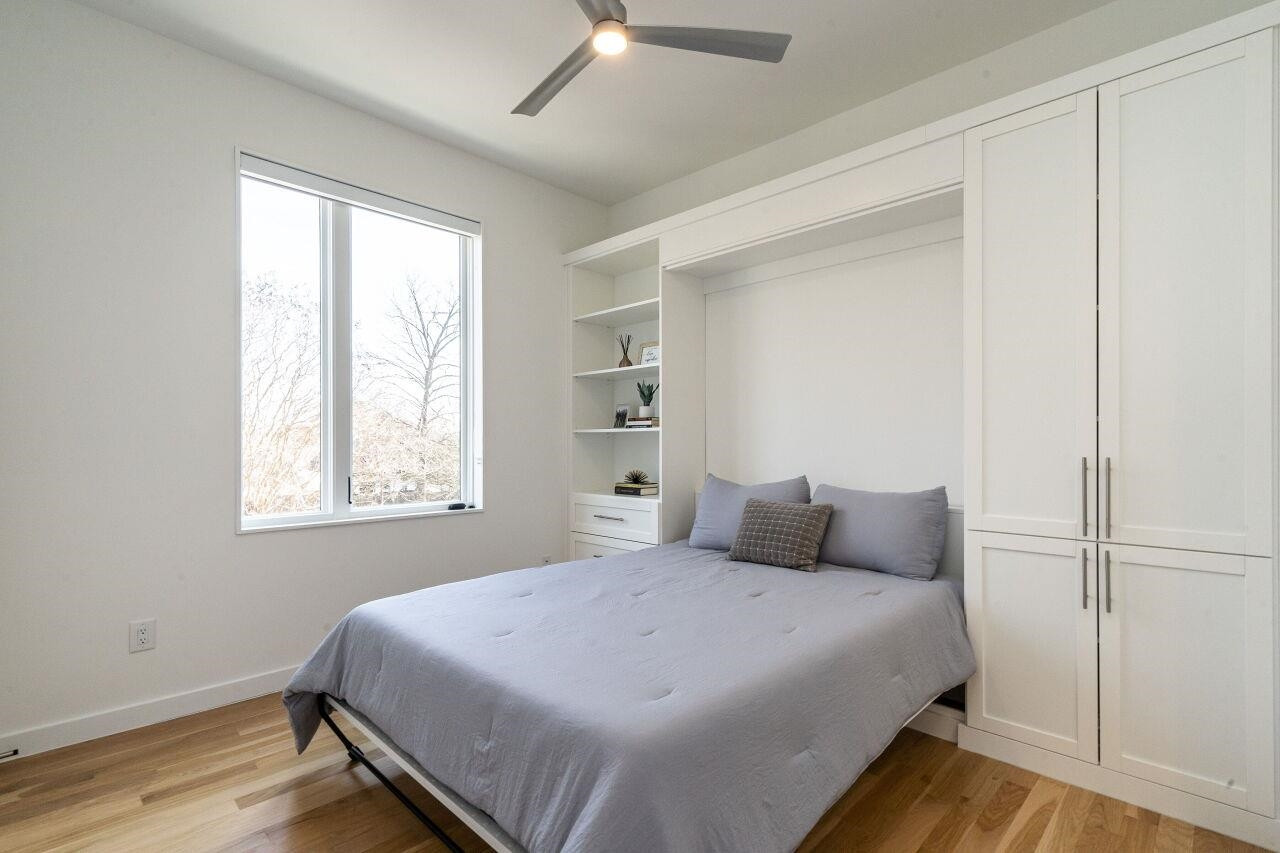424 Chavis Way Raleigh, NC 27601 - Photo 15 of 23 a bedroom with a bed and a window