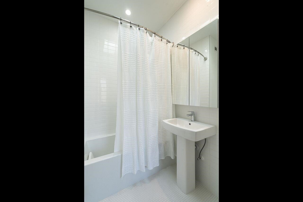 424 Chavis Way Raleigh, NC 27601 - Photo 17 of 23 a bathroom with a sink and mirror