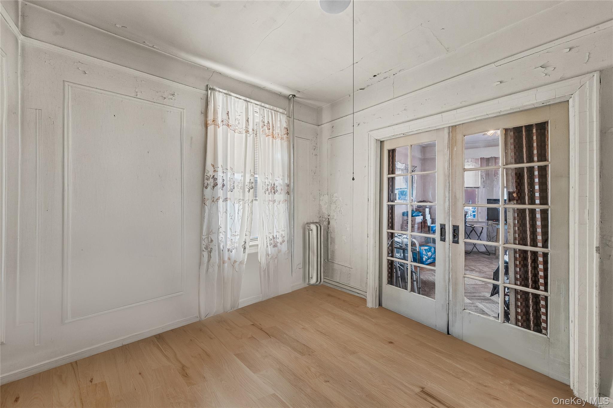 39-27 57th Street Queens, NY 11377 - Photo 9 of 35 a view of livingroom with furniture and wooden floor