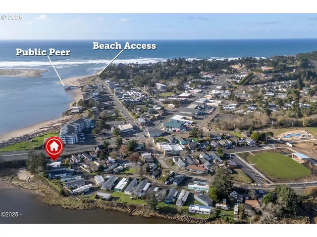 a living room with furniture a rug and a large window