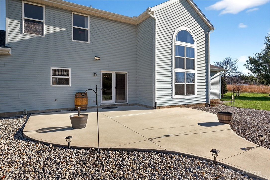6560 Snyder Road Fletcher, OH 45326 - Photo 46 of 71 This residence features a patio for outdoor enjoyment, complemented by expansive windows and durable siding.