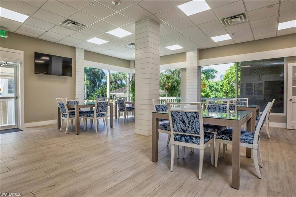 5501 Heron Point Drive, Unit 204 Naples, FL 34108 - Photo 20 of 23 a view of a dining room with furniture window and outside view