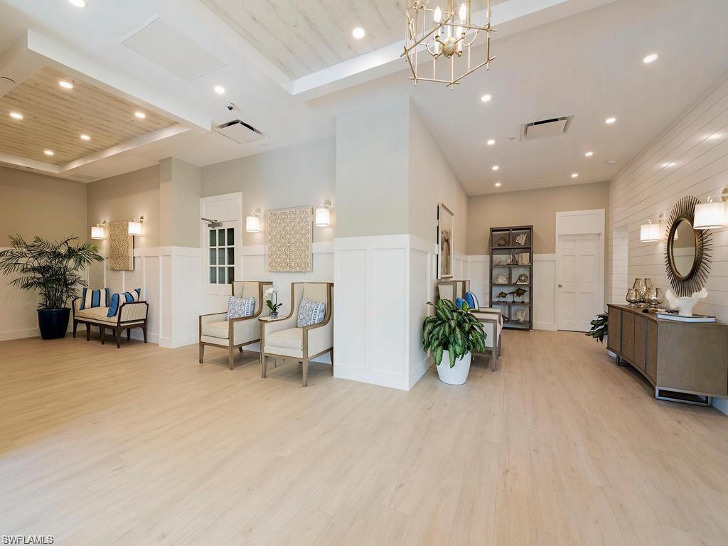 5501 Heron Point Drive, Unit 204 Naples, FL 34108 - Photo 21 of 23 a lobby with furniture and a chandelier