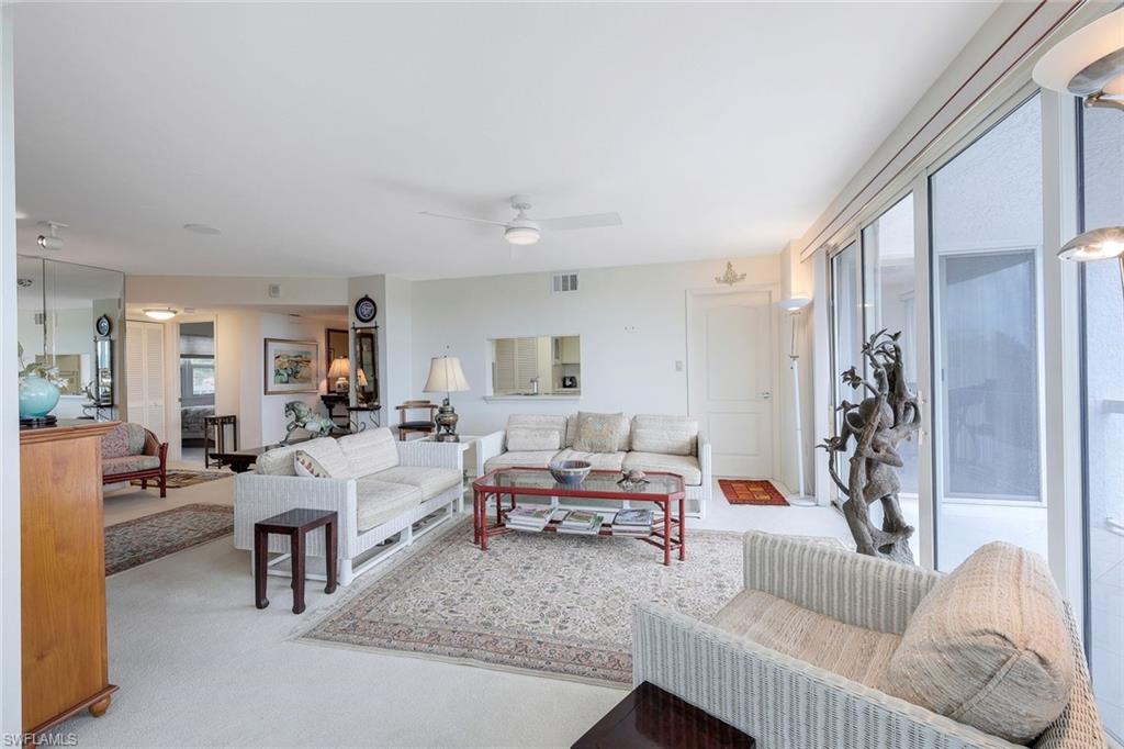5501 Heron Point Drive, Unit 204 Naples, FL 34108 - Photo 6 of 23 a living room with furniture and a couch
