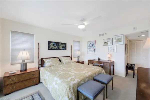 a bed room with a bed and a lamp