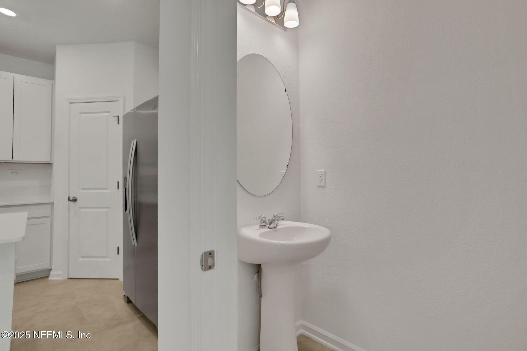 3765 Athenian Way Middleburg, FL 32068 - Photo 27 of 61 a bathroom with a sink and a mirror