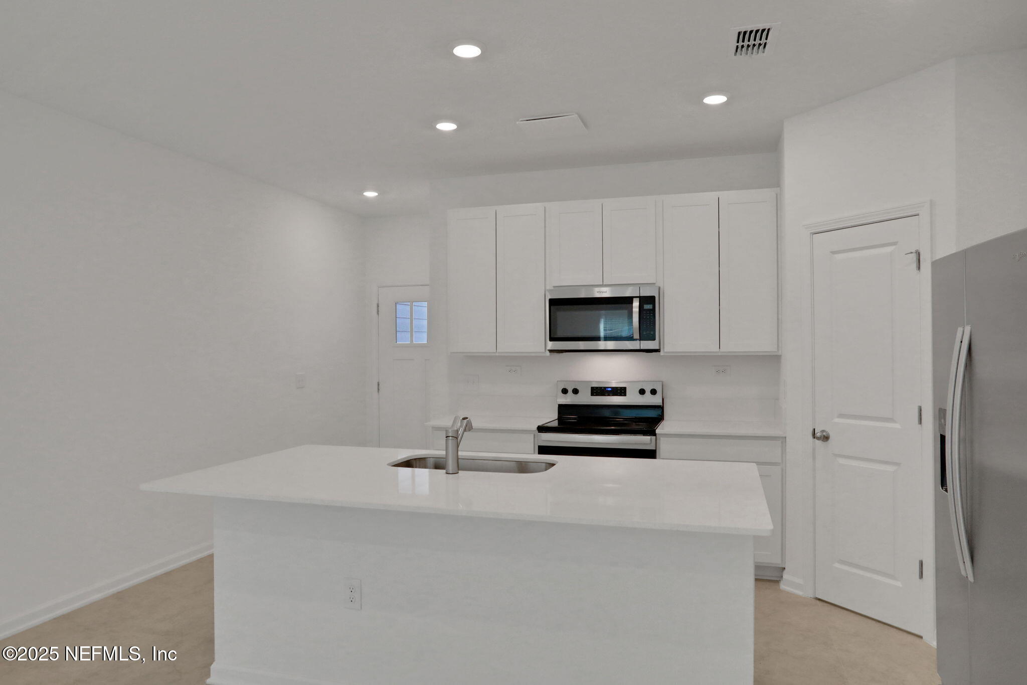 3765 Athenian Way Middleburg, FL 32068 - Photo 34 of 61 a kitchen with stainless steel appliances a stove a sink and a refrigerator