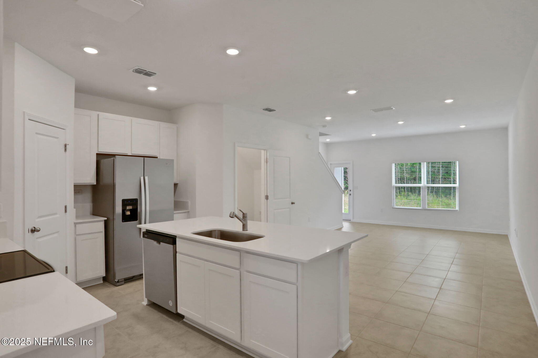 3765 Athenian Way Middleburg, FL 32068 - Photo 38 of 61 a kitchen with refrigerator and cabinets