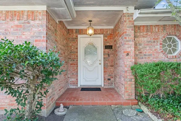 a view of a brick house with a windows