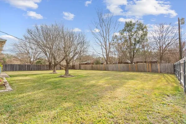 a view of yard and swimming pool