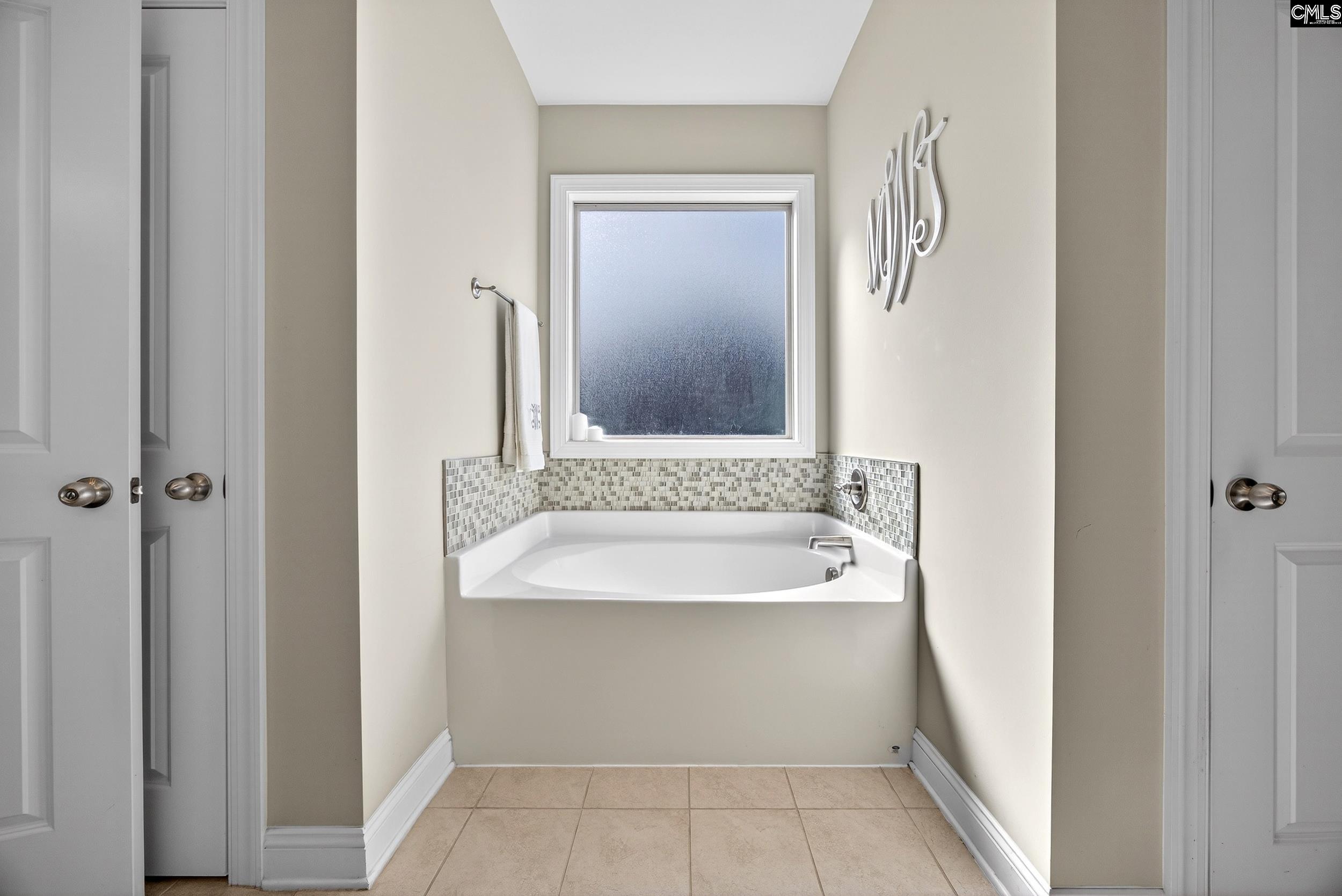 116 Renard Way Gilbert, SC 29054 - Photo 39 of 74 a bathroom with a sink and a mirror