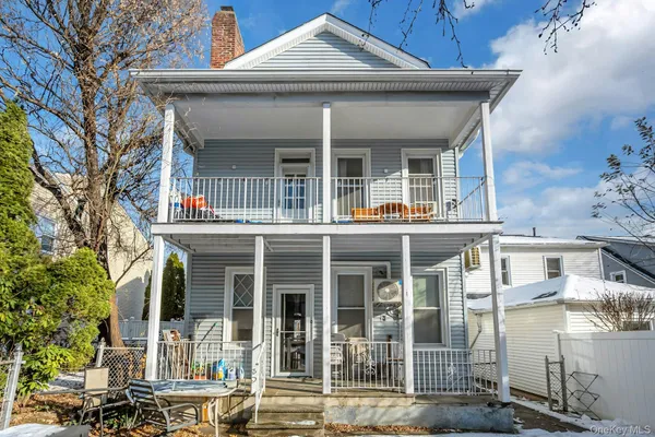 front view of a brick house with a large windows