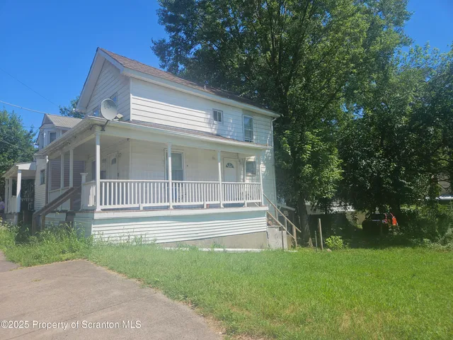 a house view with a garden space