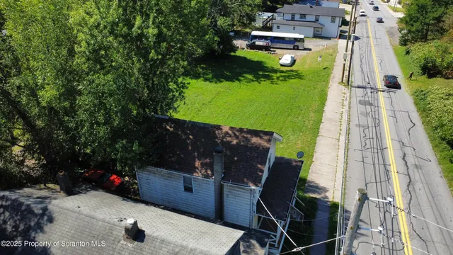 a view of a backyard with sitting area