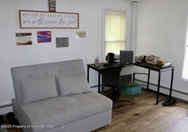 a living room with furniture and a window