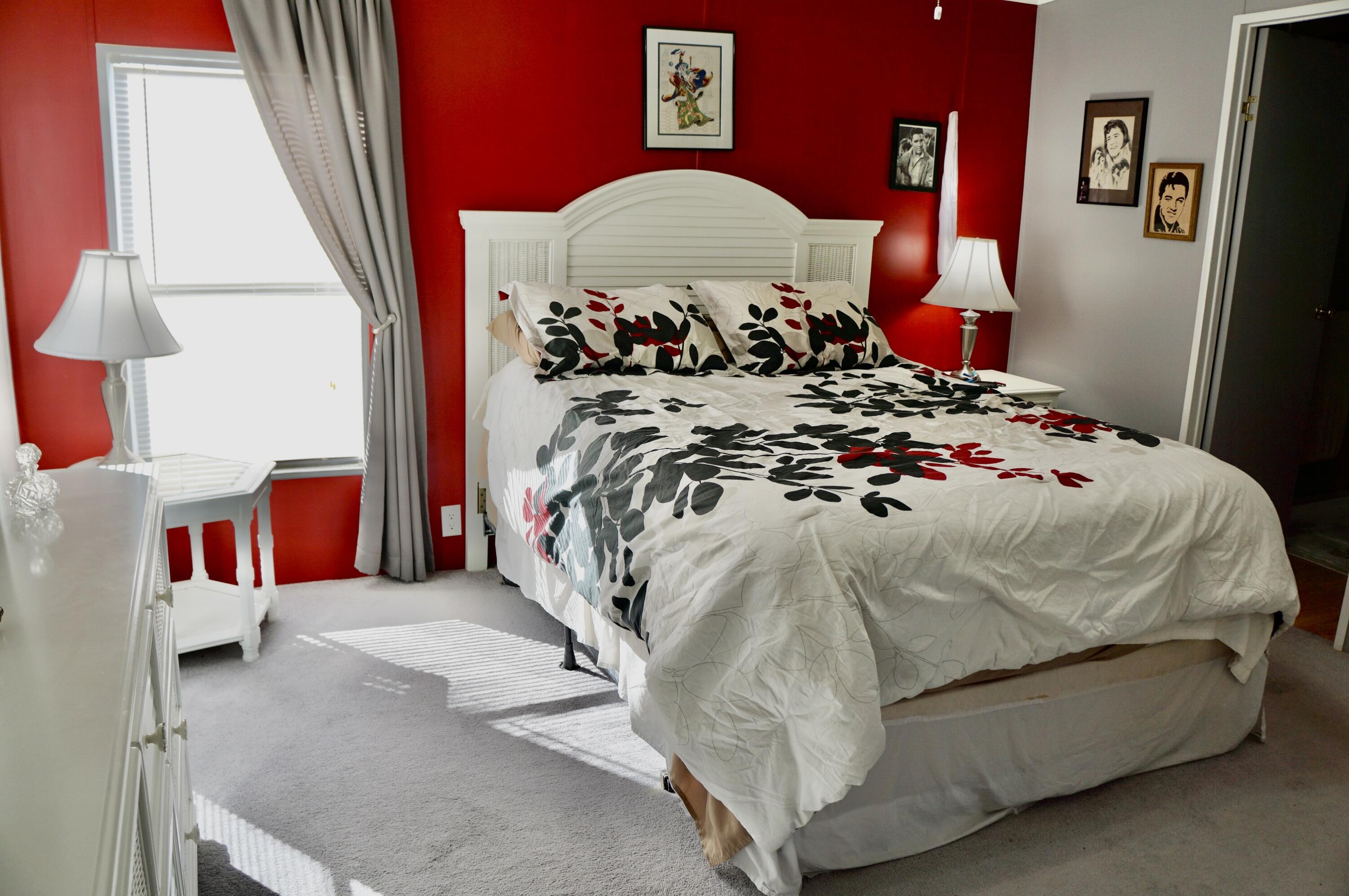 14333 Azucena Court Fort Pierce, FL 34951 - Photo 13 of 28 a bed sitting in a bedroom next to a window