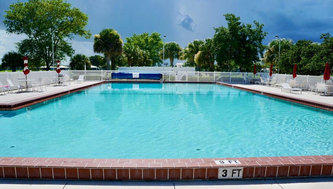 14333 Azucena Court Fort Pierce, FL 34951 - Photo 23 of 28 a view of swimming pool with seating space
