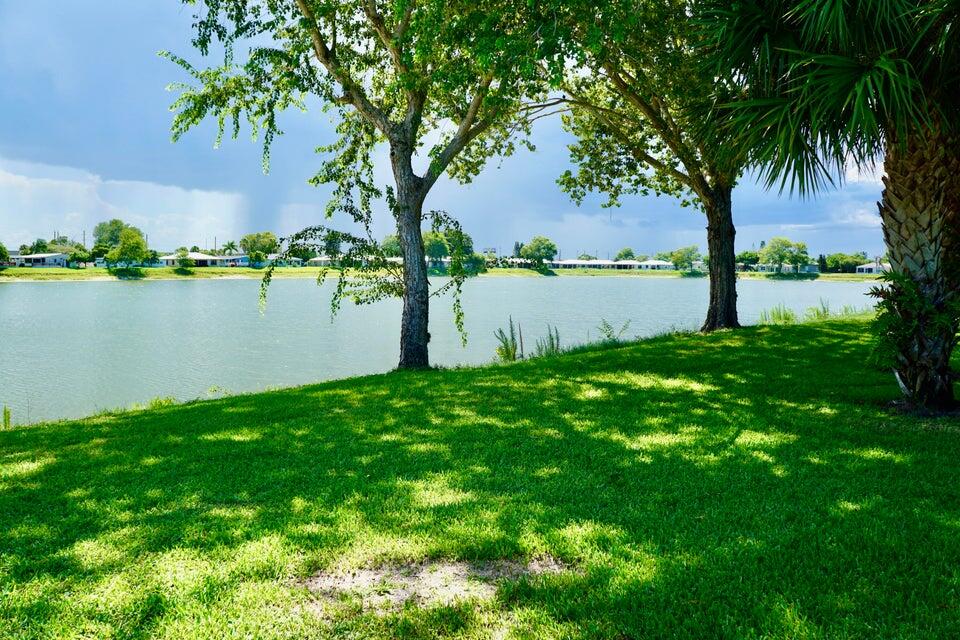 14333 Azucena Court Fort Pierce, FL 34951 - Photo 25 of 28 a view of lake with green space