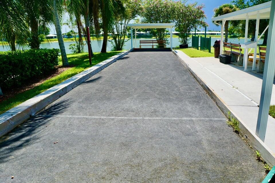14333 Azucena Court Fort Pierce, FL 34951 - Photo 26 of 28 a view of a patio with swimming pool