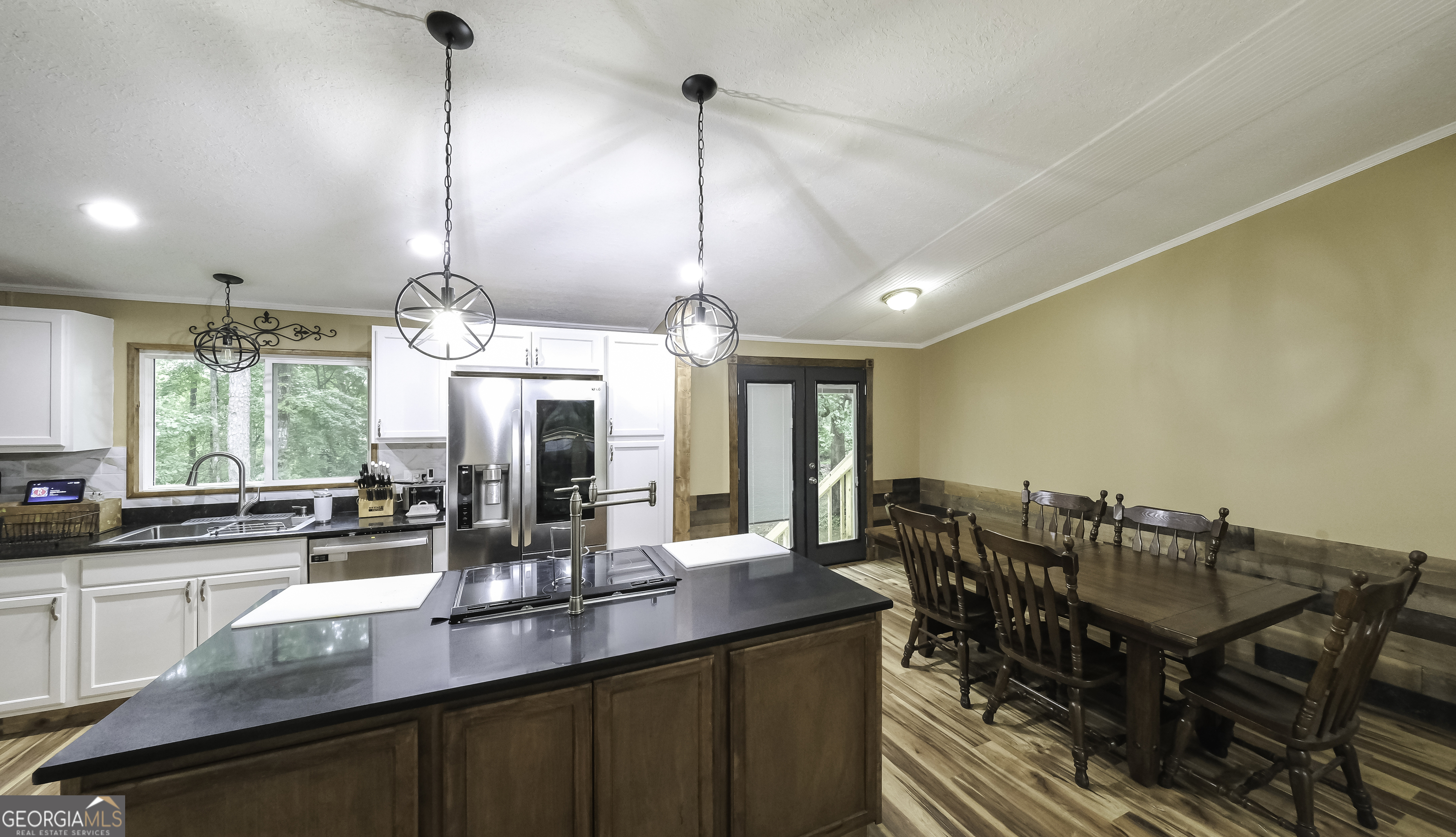 91 Holder Road Temple, GA 30179 - Photo 8 of 40 a kitchen with a dining table chairs and sink