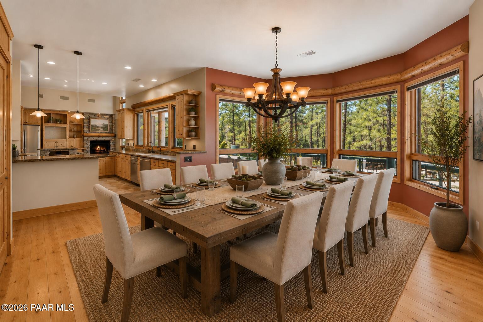 5140 East Charcoal Kiln Road Prescott, AZ 86303 - Photo 33 of 140 a dining room with furniture a chandelier and wooden floor