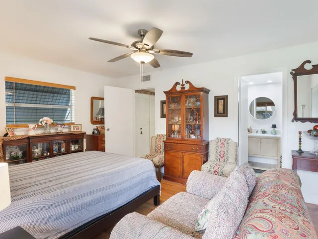 a bedroom with bed and window