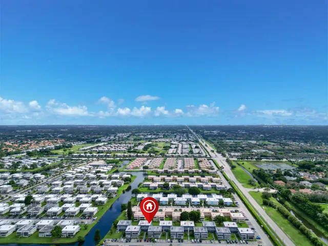 an aerial view of city and green space