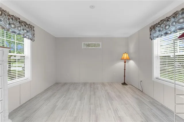 a view of empty room with windows