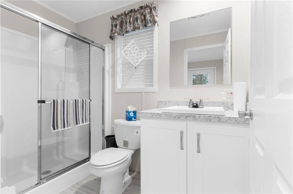 318 Meadowbrook Road Hermitage, PA 16148 - Photo 13 of 18 a bathroom with a sink toilet and shower