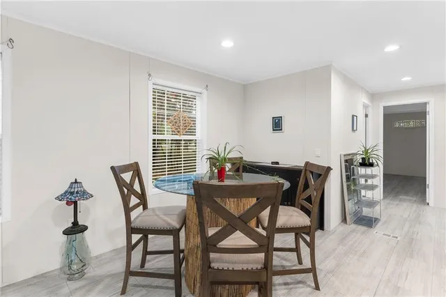 a dining room with furniture and window