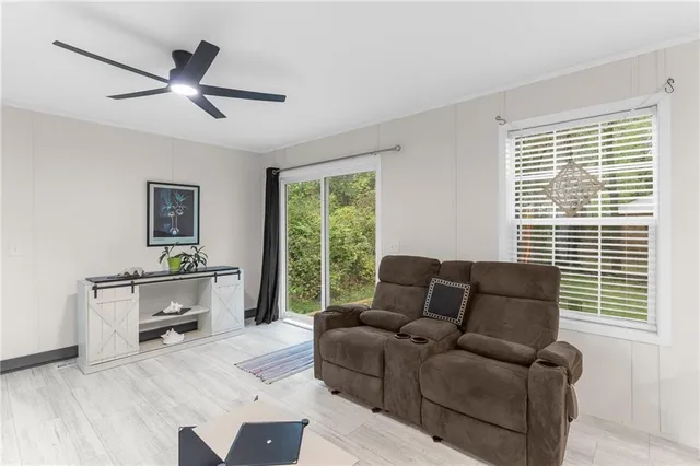 a living room with furniture and a window