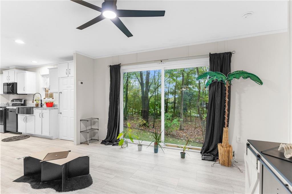 318 Meadowbrook Road Hermitage, PA 16148 - Photo 10 of 18 a living room with furniture and a floor to ceiling window