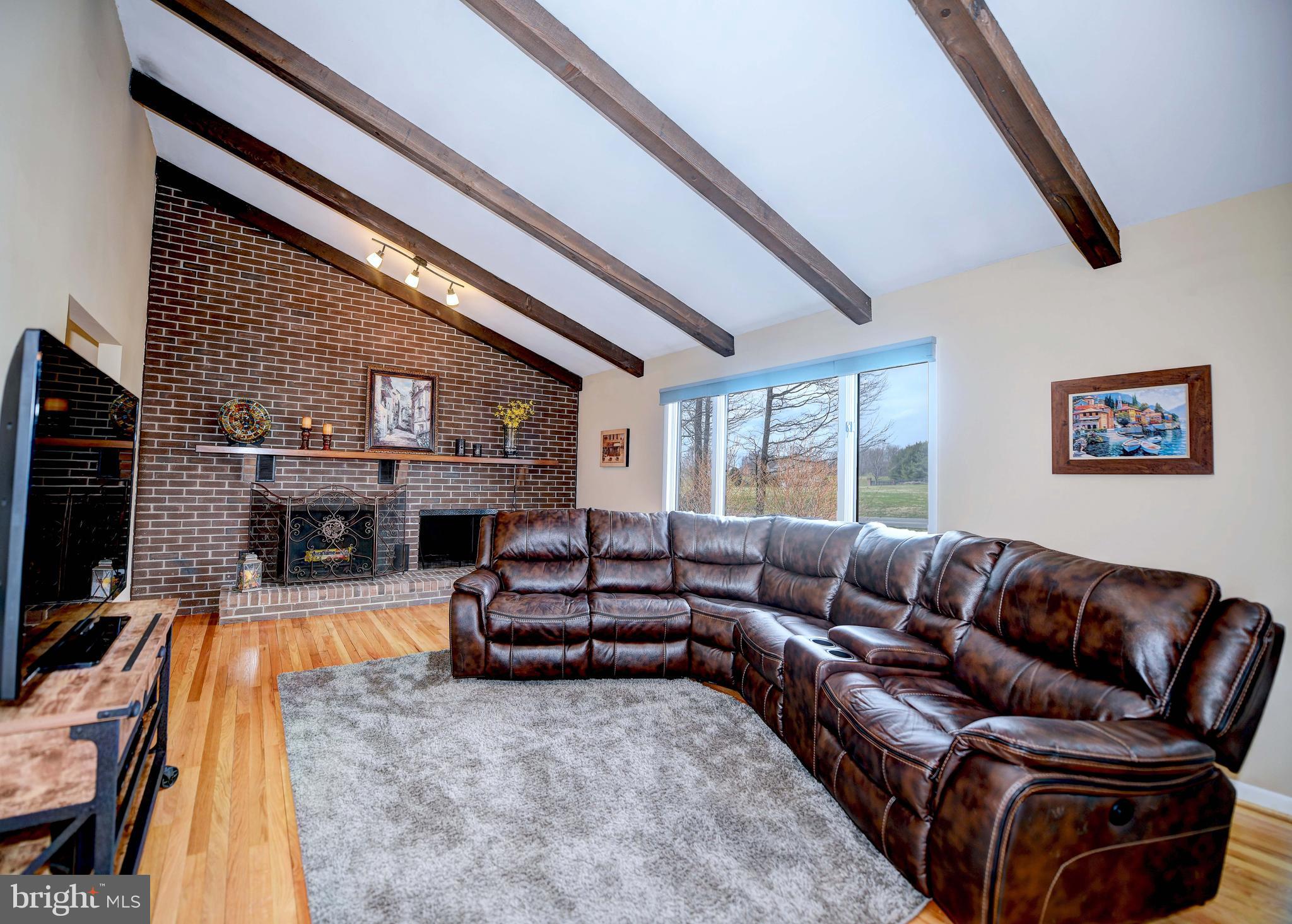 1703 Cosner Road Forest Hill, MD 21050 - Photo 6 of 44 Fireplace w brick surround extending full wall
