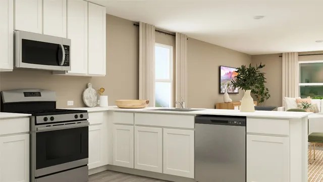 a kitchen with a sink stove and microwave