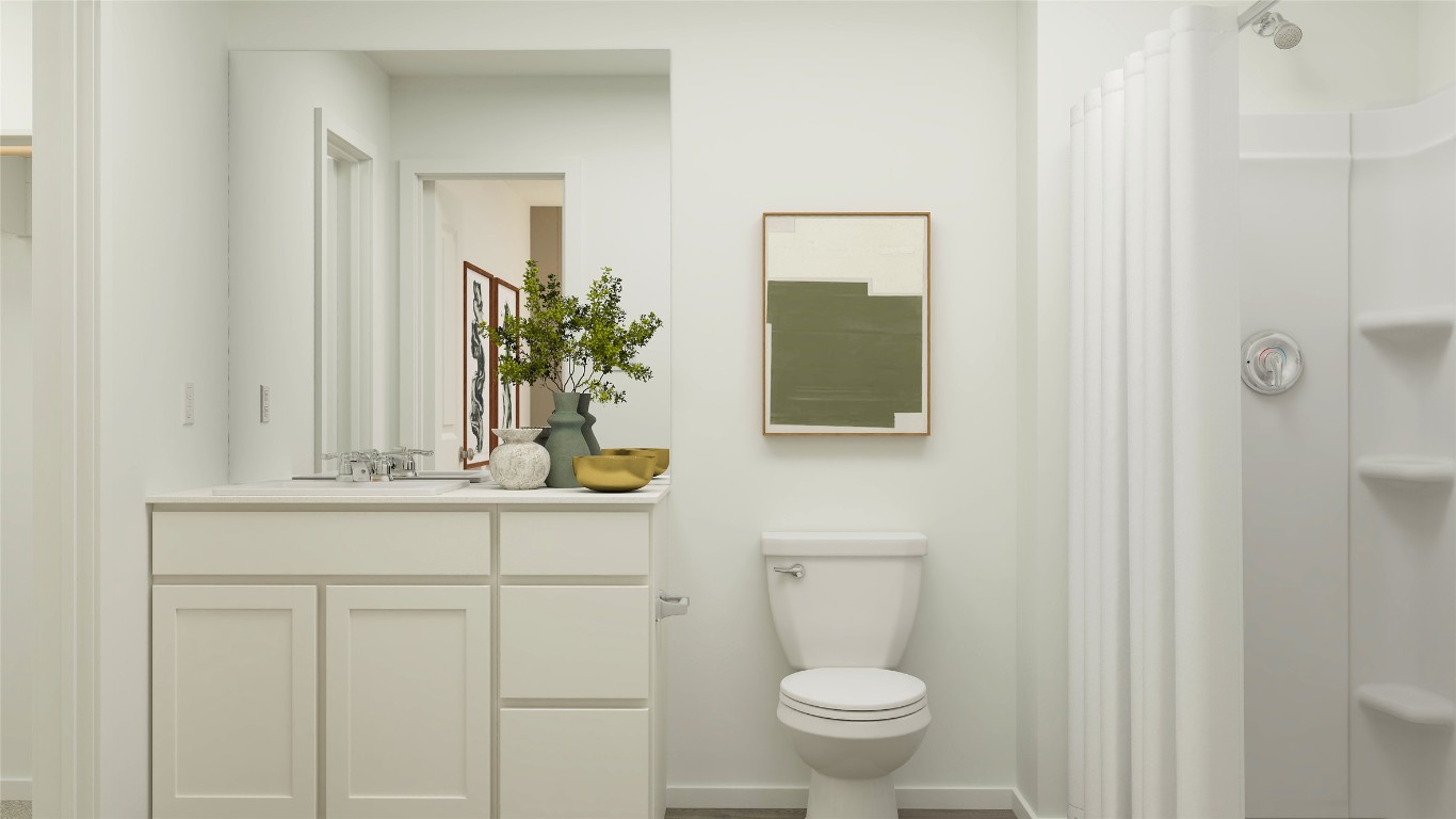433 Silvercloud Drive Lockhart, TX 78644 - Photo 28 of 31 a bathroom with a toilet a sink and mirror