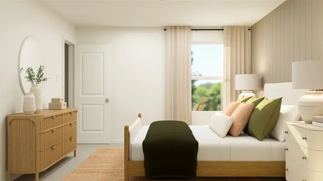 a bedroom with furniture and a window