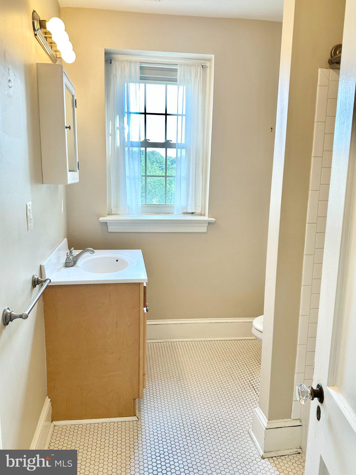 212 Idris Road, Unit F3 Merion Station, PA 19066 - Photo 17 of 25 Morning sun hits the full bathroom.