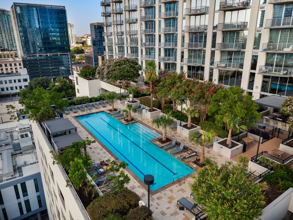 360 Nueces Street, Unit 1805 Austin, TX 78701 - Photo 3 of 28 an aerial view of multiple houses with yard