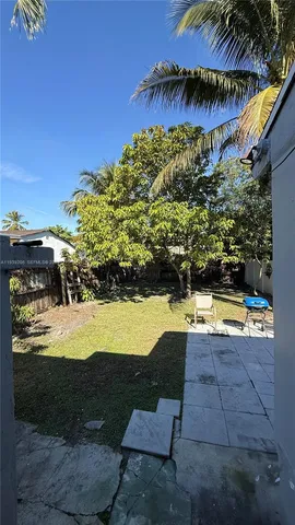 a view of swimming pool with a yard