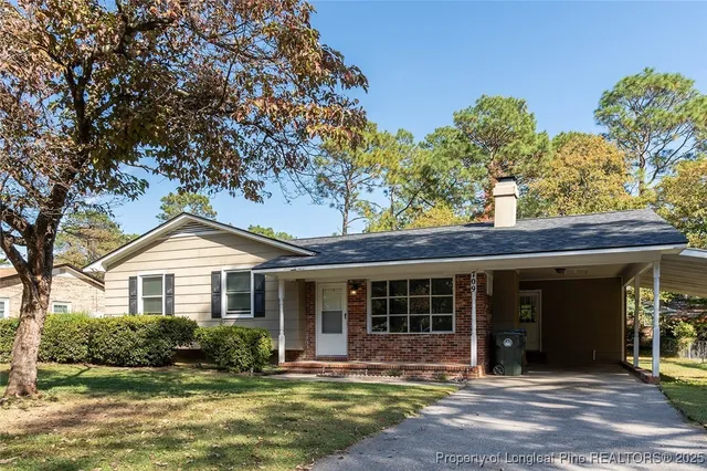 a front view of a house with garden and porch