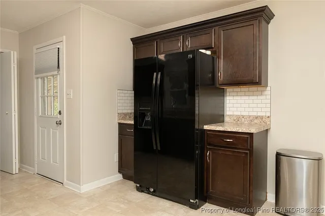 a bathroom with a shower a mirror and a sink