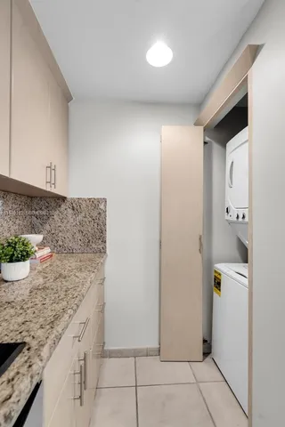 an aerial view of residential houses with outdoor space and swimming pool