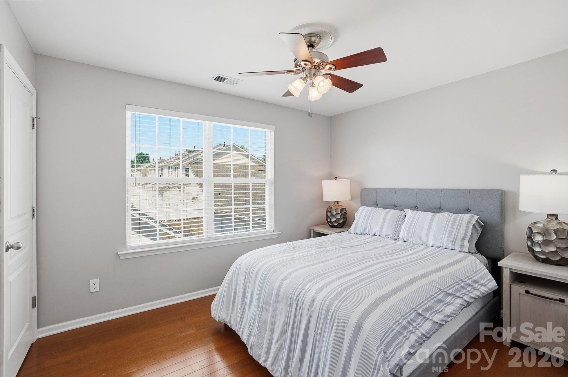 8512 Sunset Hill Road Waxhaw, NC 28173 - Photo 17 of 36 a bedroom with a large bed and a window