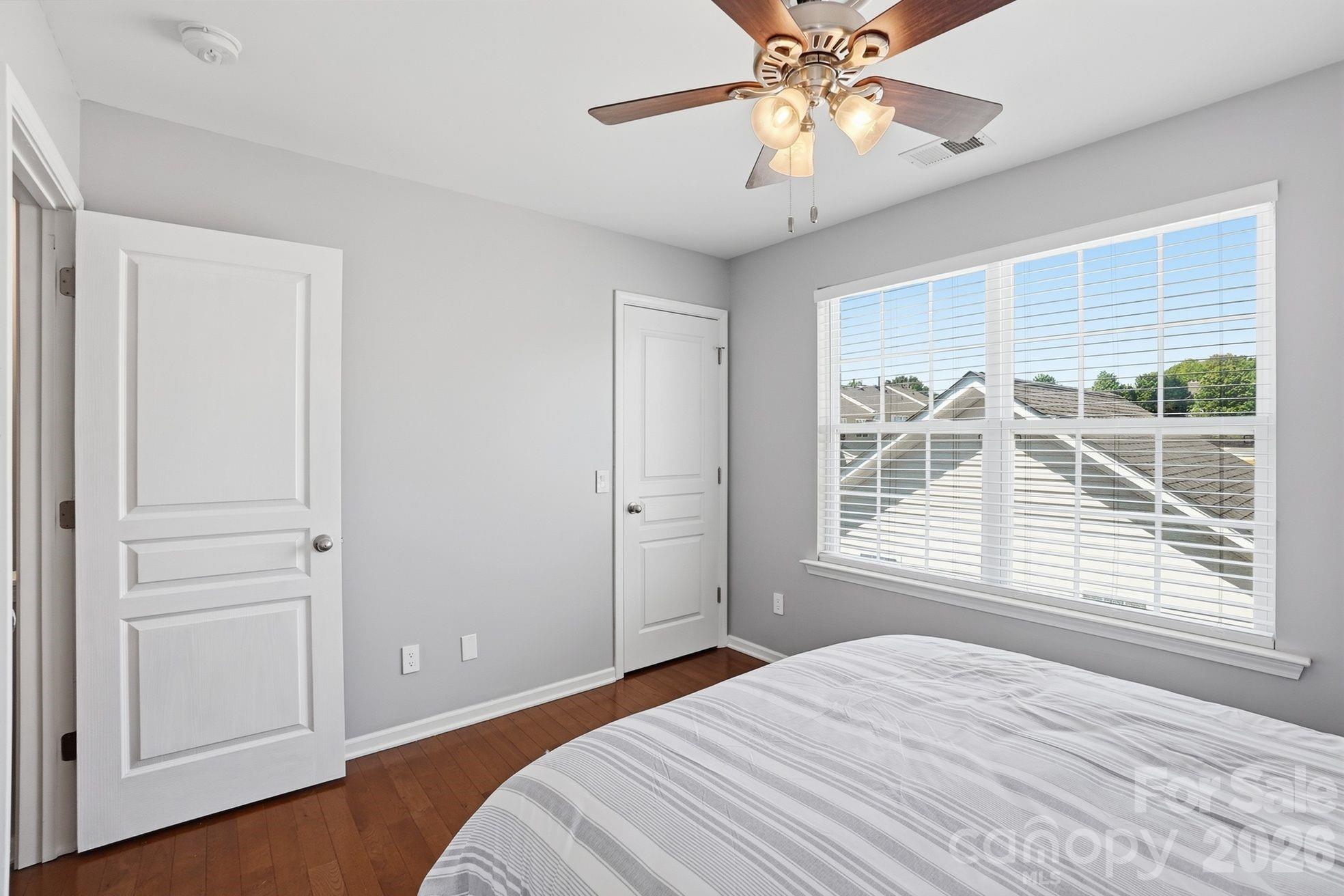 8512 Sunset Hill Road Waxhaw, NC 28173 - Photo 18 of 36 a bedroom with a bed and a window