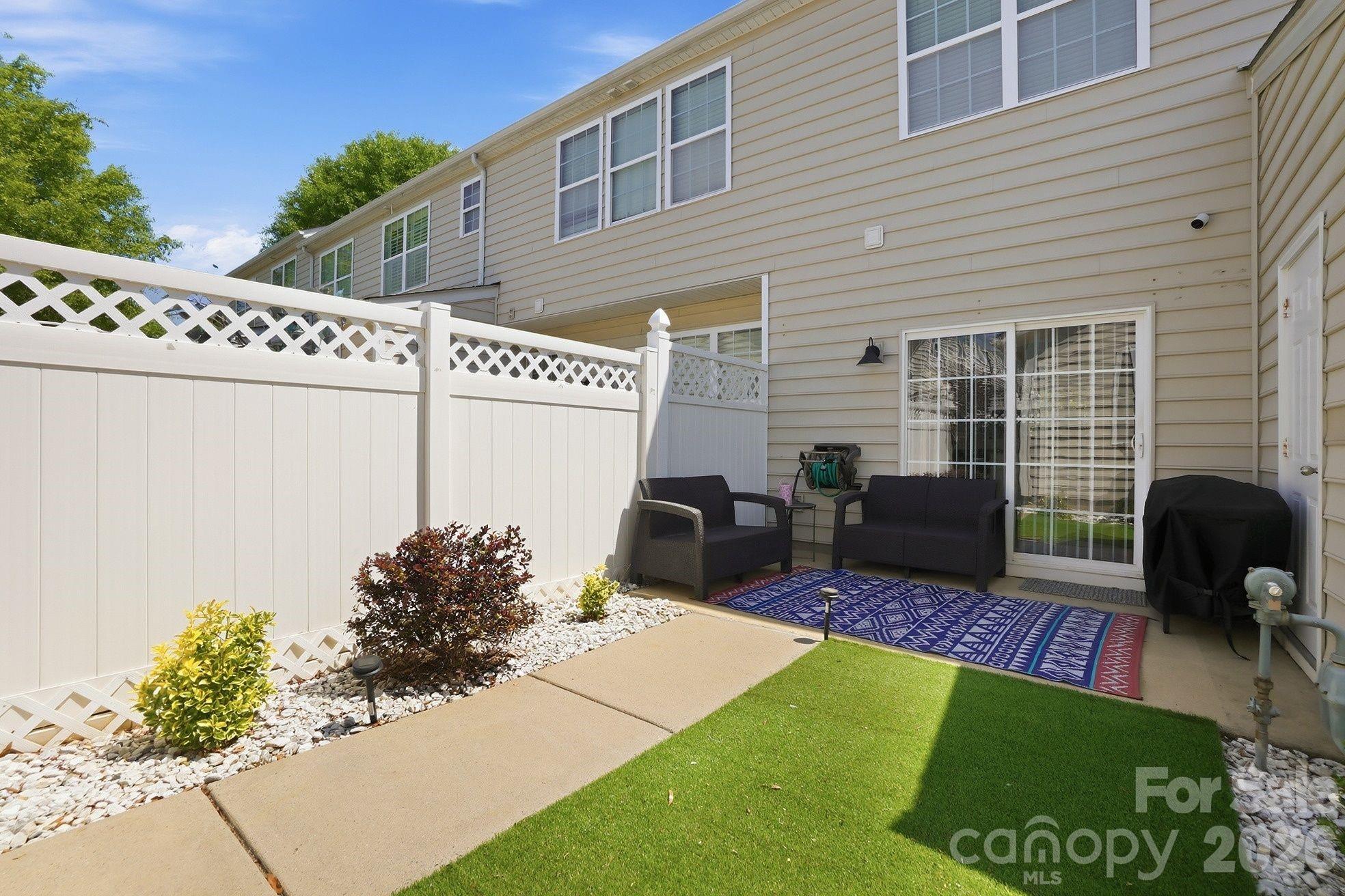 8512 Sunset Hill Road Waxhaw, NC 28173 - Photo 28 of 36 a view of a backyard with furniture