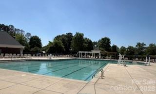 8512 Sunset Hill Road Waxhaw, NC 28173 - Photo 33 of 36 a view of swimming pool from a garden
