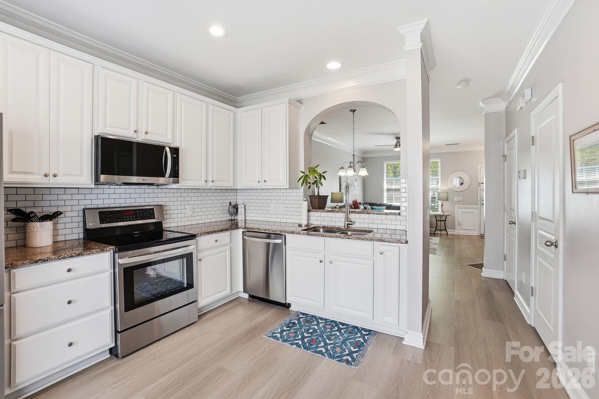 8512 Sunset Hill Road Waxhaw, NC 28173 - Photo 5 of 36 a kitchen with sink cabinets and stainless steel appliances